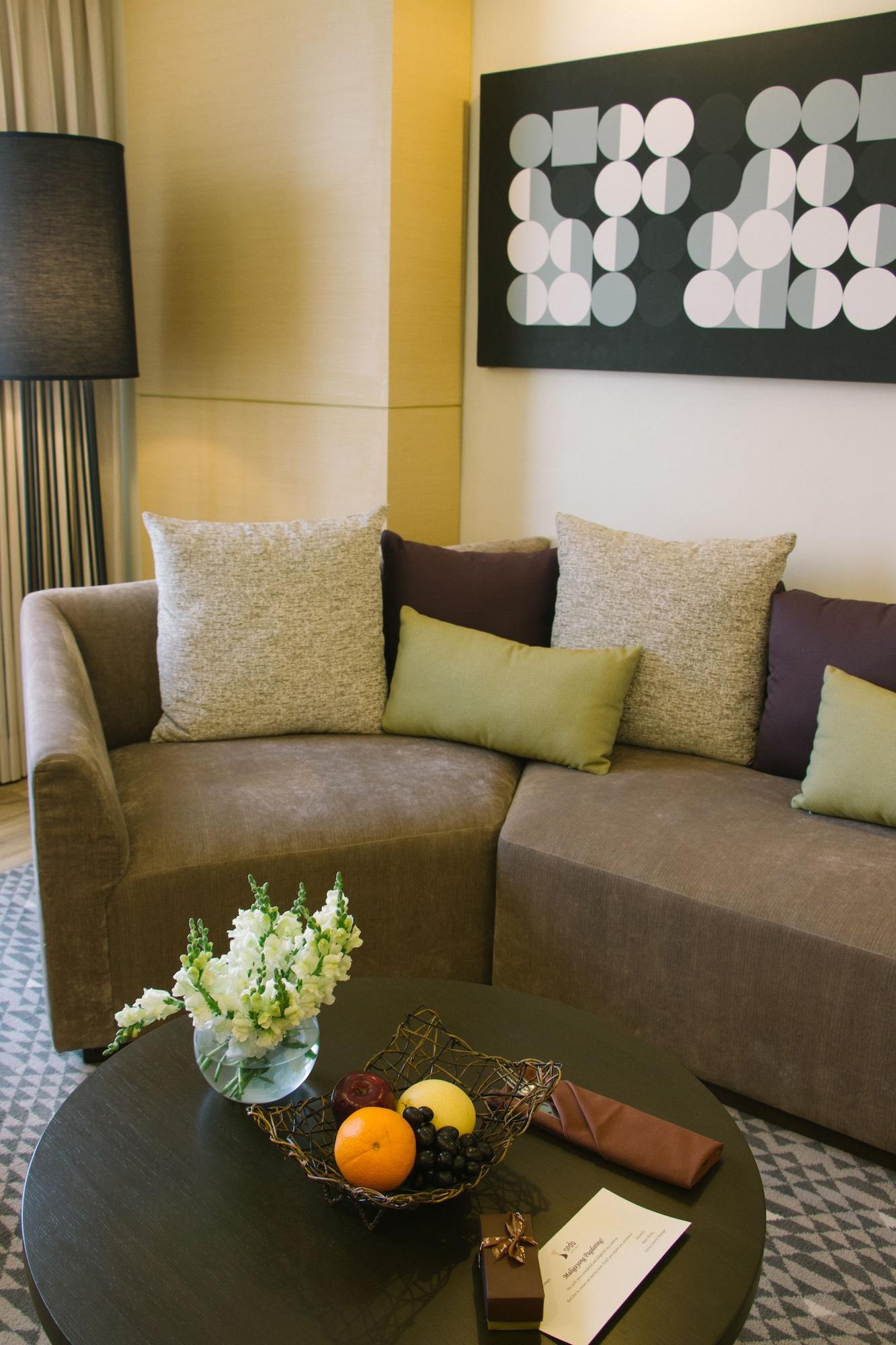 Seda Vertis North Quezon City Exterior photo A sofa with cushions