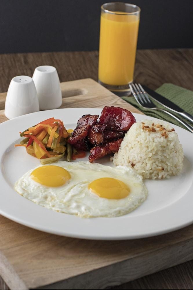 Seda Vertis North Quezon City Exterior photo Filipino breakfast with longganisa, garlic rice, eggs, and pinakbet
