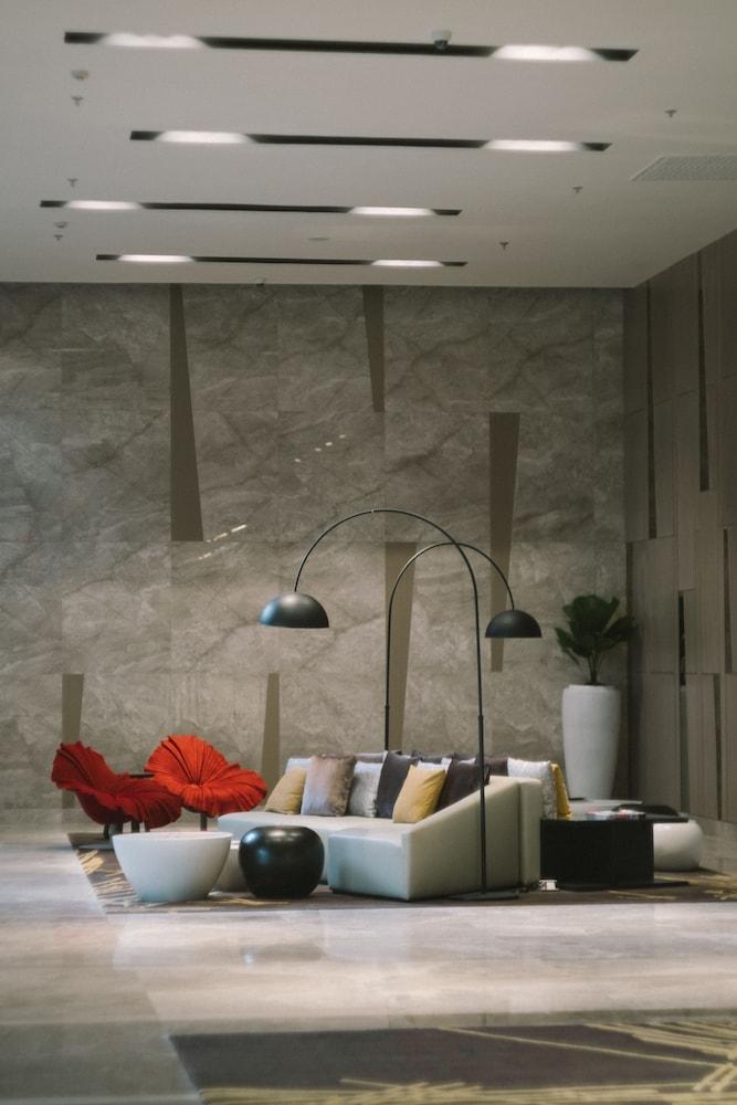 Seda Vertis North Quezon City Exterior photo A three-armed floor lamp