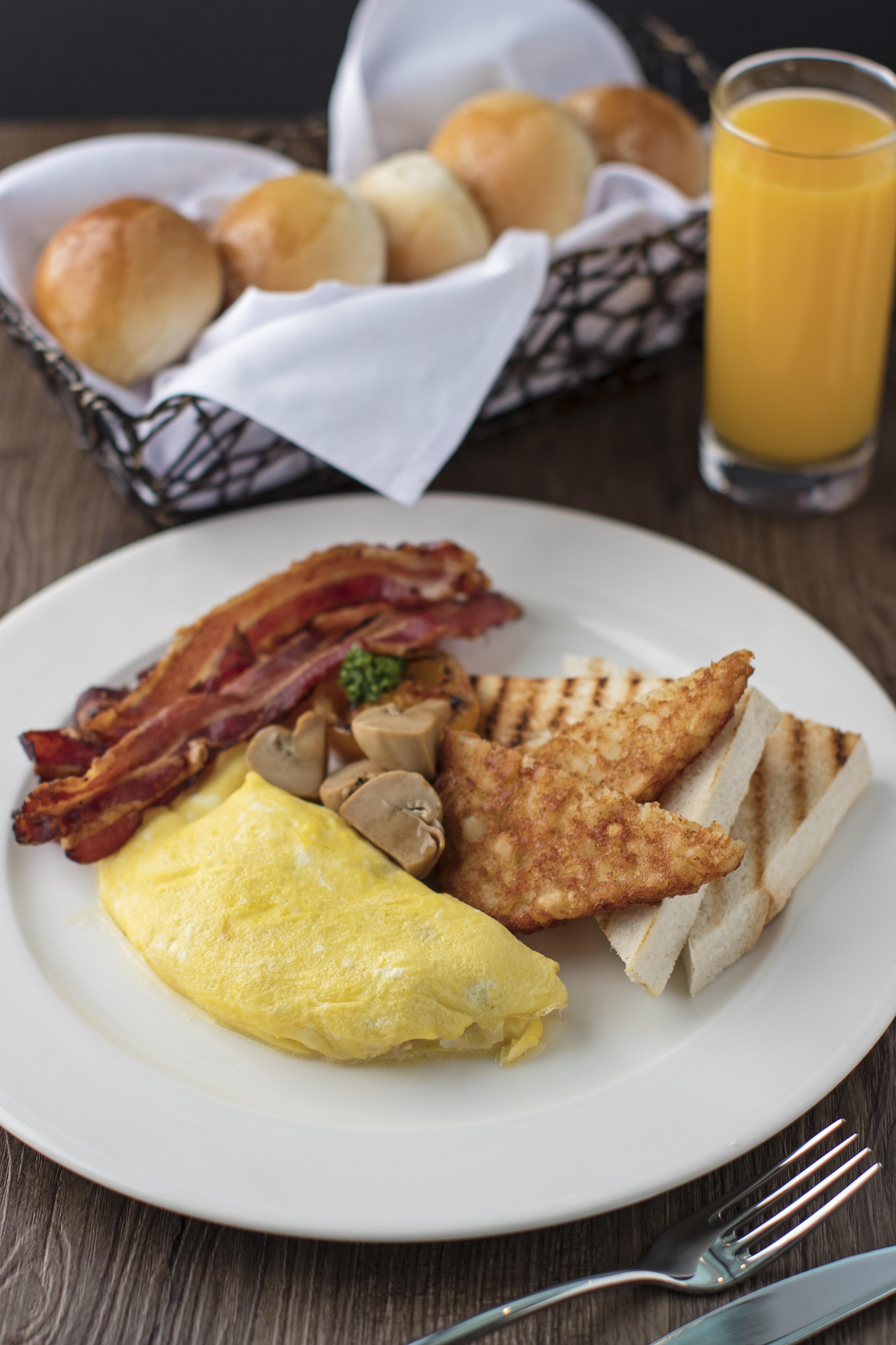 Seda Vertis North Quezon City Exterior photo A breakfast plate with bacon, eggs, and toast
