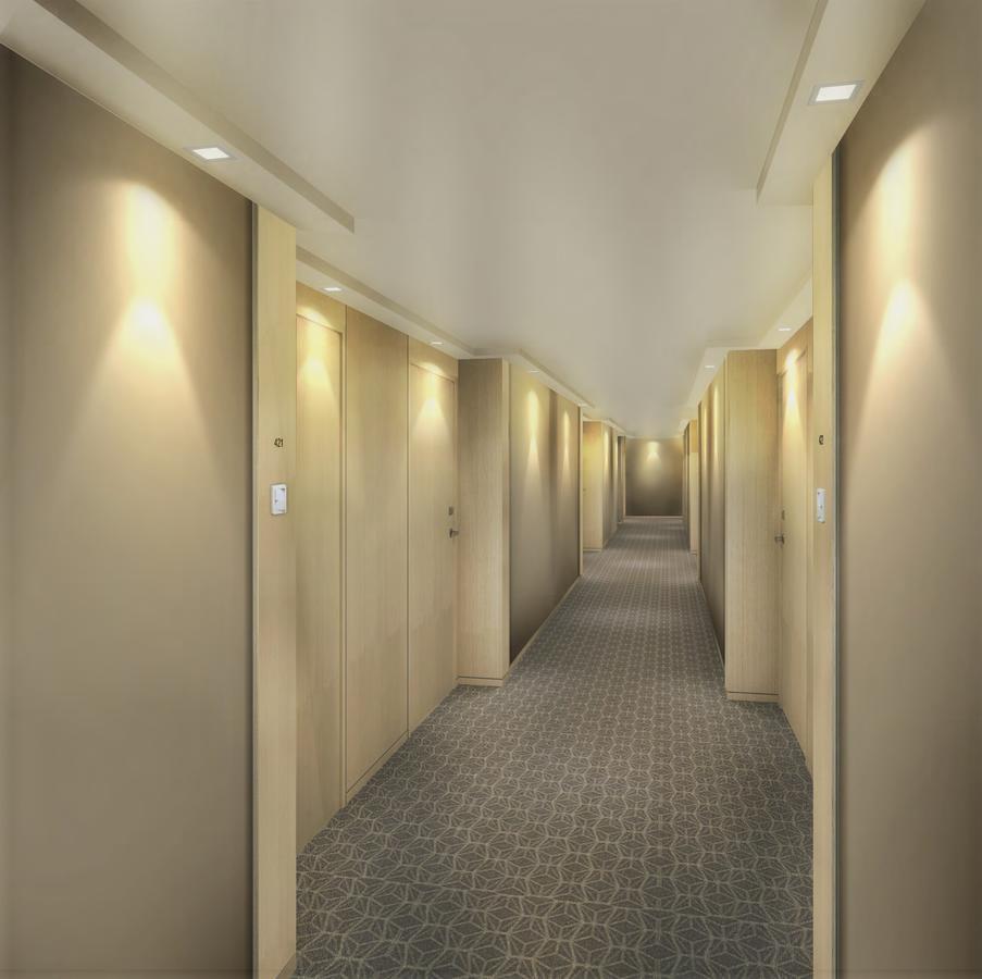 Seda Vertis North Quezon City Exterior photo A typical hotel corridor